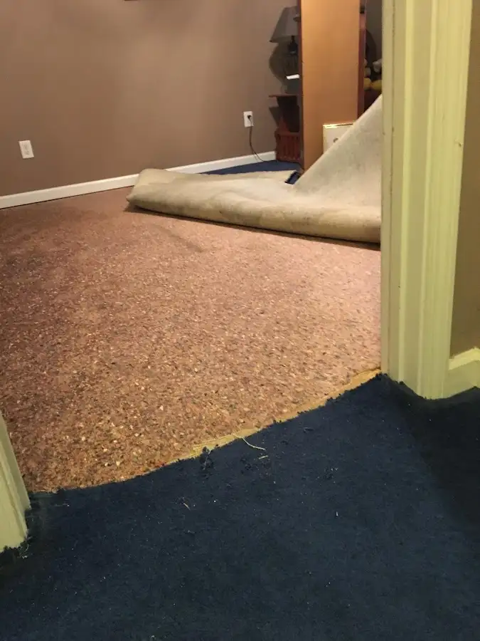 Carpet pad removal revealing water damage during Drying & Dehumidification in Plaquemine
