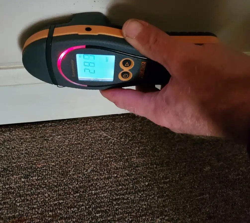 Moisture detection at baseboard during Storm Damage Restoration in Plaquemine